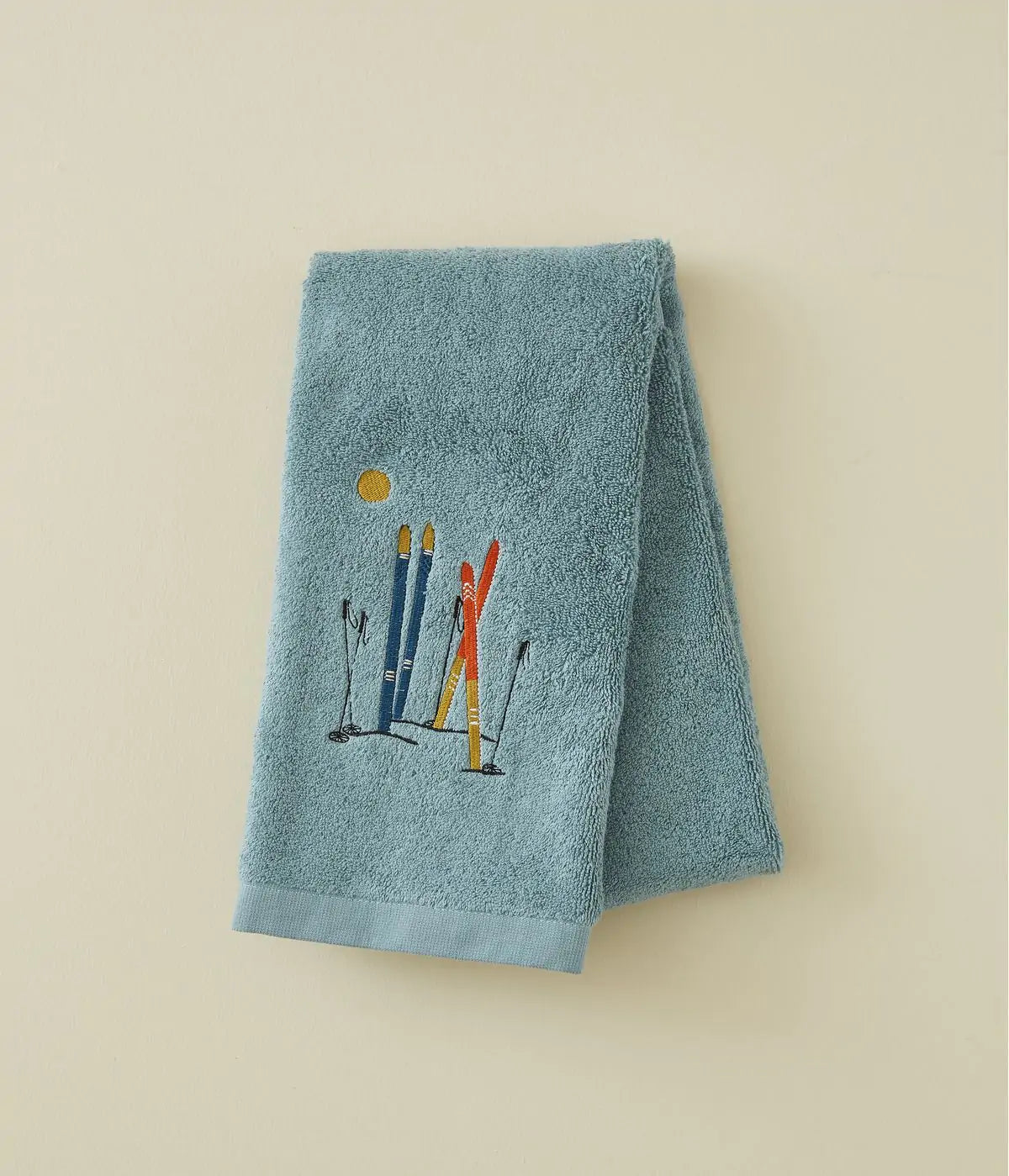 Cotton bath linen with embroidered fish